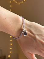 Tanzanite & silver charm keeper bracelet