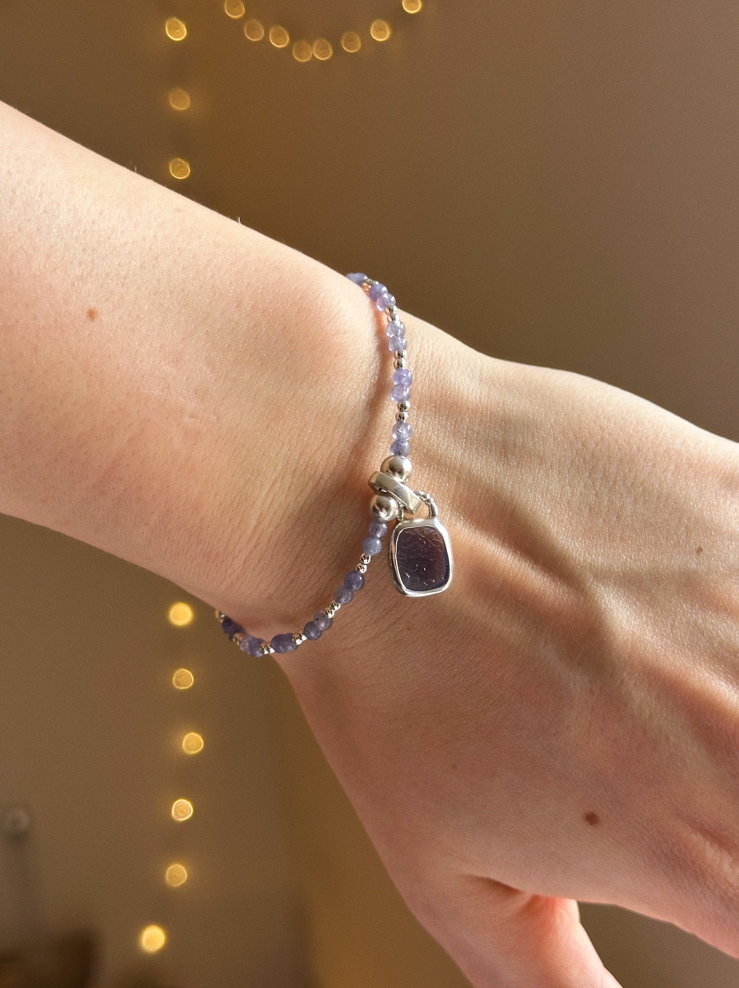 Tanzanite & silver charm keeper bracelet