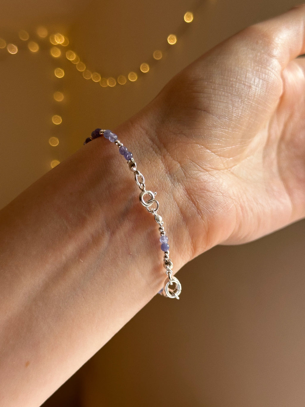Tanzanite & silver charm keeper bracelet