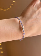 Tanzanite & silver charm keeper bracelet