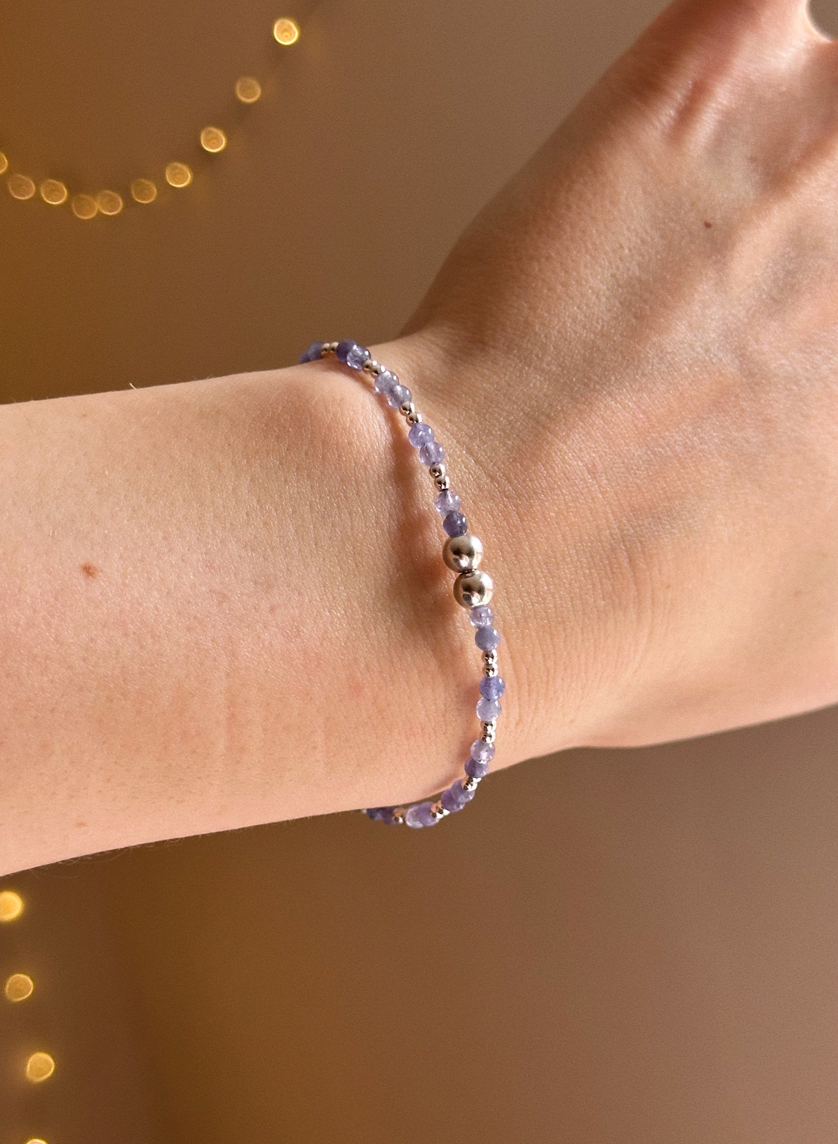 Tanzanite & silver charm keeper bracelet